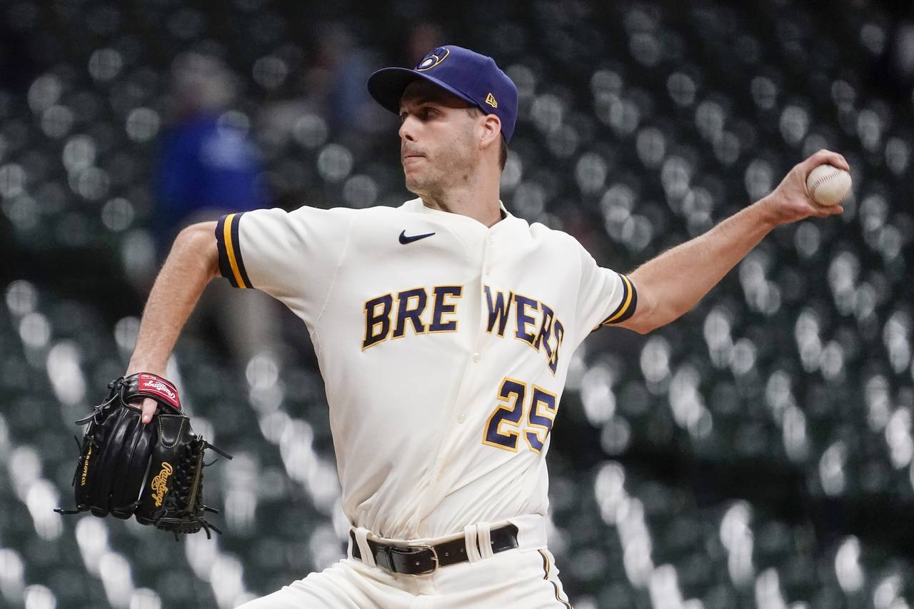 FILE -Milwaukee Brewers' Taylor Rogers throws during the eighth inning of a baseball game against t...