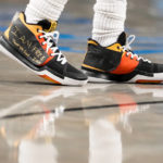 
              Brooklyn Nets guard Kyrie Irving (11) wears sneakers with logos covered in tape with the words "I AM FREE Thank you God … I AM" written in gold colored marker during the second half of an NBA basketball game against the Charlotte Hornets, Wednesday, Dec. 7, 2022, in New York. (AP Photo/John Minchillo)
            