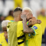 
              Brazil's Neymar is embraced by Brazil's Raphinha at the end of the World Cup quarterfinal soccer match between Croatia and Brazil, at the Education City Stadium in Al Rayyan, Qatar, Friday, Dec. 9, 2022. (AP Photo/Darko Bandic)
            