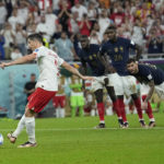 
              Poland's Robert Lewandowski scores on a penalty kick during the World Cup round of 16 soccer match between France and Poland, at the Al Thumama Stadium in Doha, Qatar, Sunday, Dec. 4, 2022. (AP Photo/Ebrahim Noroozi)
            