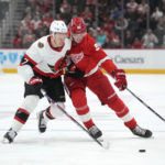 
              Ottawa Senators left wing Brady Tkachuk (7) and Detroit Red Wings left wing Elmer Soderblom (85) battle for the puck in the second period of an NHL hockey game Saturday, Dec. 17, 2022, in Detroit. (AP Photo/Paul Sancya)
            