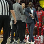 
              St. John's head coach Mike Anderson is held back as St. John's bench is assessed with a technical foul during the first half of an NCAA college basketball game against Iowa State, Sunday, Dec. 4, 2022, in Ames, Iowa. (AP Photo/ Matthew Putney)
            