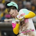 
              San Diego Padres' Brandon Drury is hit in the helmet by a pitch during the fourth inning of a baseball game against the Chicago White Sox, Friday, Sept. 30, 2022, in San Diego. (AP Photo/Gregory Bull)
            