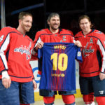 
              FILE - Washington Capitals left wing Alex Ovechkin, center, of Russia, poses with a Messi soccer jersey with Nicklas Backstrom (19), of Sweden, and Brooks Orpik (44) during a ceremony in honor of his 1,000th NHL hockey game, before the team's game against the Nashville Predators on Thursday, April 5, 2018, in Washington. The happiest professional athlete outside soccer about Lionel Messi winning the World Cup might be hockey star Alex Ovechkin.  (AP Photo/Nick Wass, File)
            