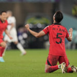 
              South Korea's Jung Woo-young celebrates after his team's 2-1 victory over Portugal at the end of the World Cup group H soccer match between South Korea and Portugal, at the Education City Stadium in Al Rayyan, Qatar, Friday, Dec. 2, 2022. (AP Photo/Ariel Schalit)
            