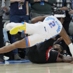 
              Oklahoma City Thunder guard Shai Gilgeous-Alexander (2) falls over Portland Trail Blazers forward Justise Winslow, right, after a foul by Winslow in the second half of an NBA basketball game Monday, Dec. 19, 2022, in Oklahoma City. (AP Photo/Sue Ogrocki)
            
