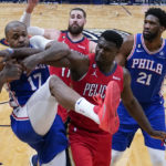 
              New Orleans Pelicans forward Zion Williamson (1) battles for a rebound with Philadelphia 76ers forward P.J. Tucker (17) in the second half of an NBA basketball game in New Orleans, Friday, Dec. 30, 2022. The Pelicans won 127-116. (AP Photo/Gerald Herbert)
            