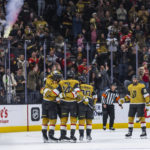 
              Vegas Golden Knights celebrate a goal against the St. Louis Blues during the first period of an NHL hockey game Friday, Dec. 23, 2022, in Las Vegas. (AP Photo/L.E. Baskow)
            