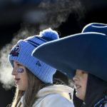 
              Fans watch teams warm up before an NFL football game between the Tennessee Titans and the Houston Texans, Saturday, Dec. 24, 2022, in Nashville, Tenn. (AP Photo/Mark Zaleski)
            