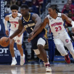 
              New Orleans Pelicans forward Zion Williamson (1) scoops in a loose ball against Detroit Pistons guard Jaden Ivey (23) in the first half of an NBA basketball game in New Orleans, Wednesday, Dec. 7, 2022. (AP Photo/Gerald Herbert)
            