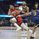 
              Houston Rockets forward Kenyon Martin Jr. (6) drives to the basket against Golden State Warriors guards Jordan Poole (3) and Stephen Curry (30) during the first half of an NBA basketball game in San Francisco, Saturday, Dec. 3, 2022. (AP Photo/Godofredo A. Vásquez)
            