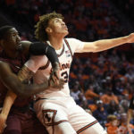 
              Illinois' Coleman Hawkins (33) battles for a rebound with Alabama A&M's Lorenzo Downey, left, during the first half of an NCAA college basketball game, Saturday, Dec. 17, 2022, in Champaign, Ill. (AP Photo/Michael Allio)
            