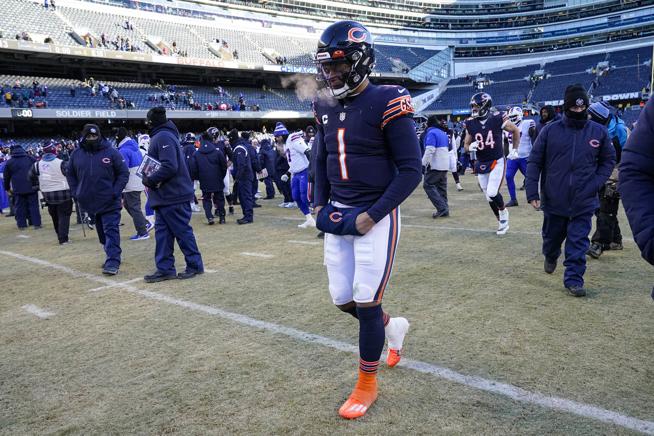 Chicago Bears quarterback Justin Fields (1) leaves the field following an NFL football game against...