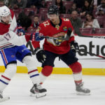 
              Montreal Canadiens right wing Josh Anderson (17) attempts a shot on the goal past Florida Panthers defenseman Brandon Montour (62) during the first period of an NHL hockey game, Thursday, Dec. 29, 2022, in Sunrise, Fla. (AP Photo/Lynne Sladky)
            