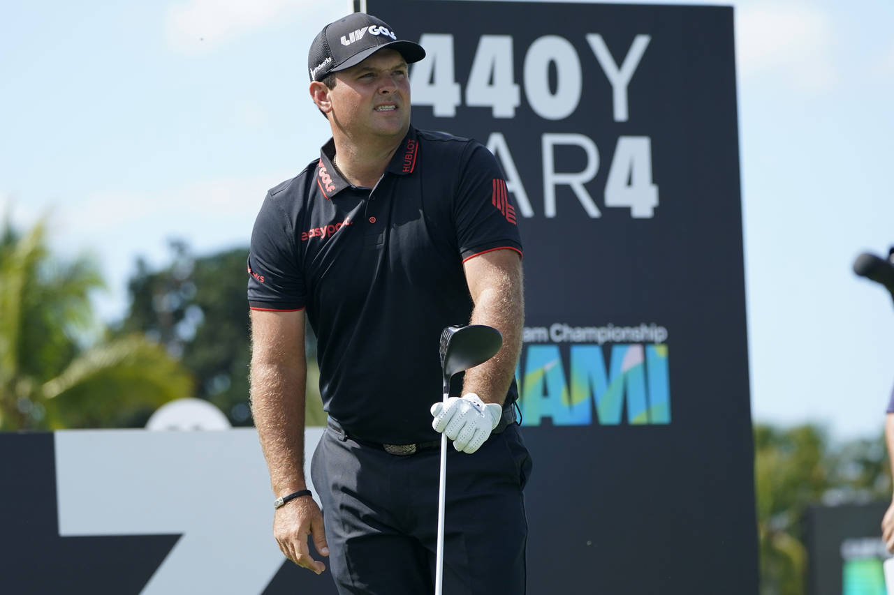 FILE - Patrick Reed watches his shot from the third tee during the final round of the LIV Golf Team...