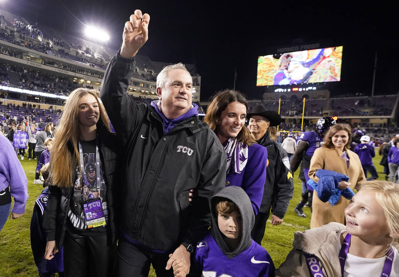 FILE - TCU head coach Sonny Dykes walks off the field after an NCAA college football game against I...