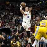 
              Miami Heat guard Tyler Herro (14) looks to pass as Los Angeles Lakers guard Lonnie Walker IV (4) defends during the first half of an NBA basketball game, Wednesday, Dec. 28, 2022, in Miami. (AP Photo/Lynne Sladky)
            