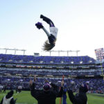 
              A cheerleader does a flip during the second half of an NFL football game between the Baltimore Ravens and the Atlanta Falcons, Saturday, Dec. 24, 2022, in Baltimore. (AP Photo/Julio Cortez)
            