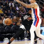 
              Los Angeles Clippers guard Reggie Jackson (1) looks to pass the ball against Detroit Pistons guard Killian Hayes (7) during the first half of an NBA basketball game, Monday, Dec. 26, 2022, in Detroit. (AP Photo/Duane Burleson)
            