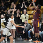 
              Arizona State guard Desmond Cambridge Jr., right, shoots a 3-point basket with seconds remaining in an NCAA college basketball game against Colorado, Thursday, Dec. 1, 2022, in Boulder, Colo. Colorado forward Tristan da Silva, left, tries to defend on the play. (AP Photo/David Zalubowski)
            