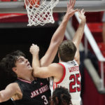 
              Utah guard Rollie Worster (25) goes to the basket as Jacksonville State center Maros Zeliznak (3) defends during the first half of an NCAA college basketball game Thursday, Dec. 8, 2022, in Salt Lake City. (AP Photo/Rick Bowmer)
            