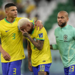 
              Brazil's Neymar reacts after the penalty shootout besides Brazil's goalkeeper Ederson and Brazil's Thiago Silva at the World Cup quarterfinal soccer match between Croatia and Brazil, at the Education City Stadium in Al Rayyan, Qatar, Friday, Dec. 9, 2022. (AP Photo/Martin Meissner)
            