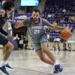 
              TCU forward JaKobe Coles (21) drives against Jackson State forward Trace Young (3) during the first half of an NCAA college basketball game in Fort Worth, Texas, Tuesday, Dec. 6, 2022. (AP Photo/LM Otero)
            