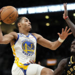 
              Toronto Raptors forward Pascal Siakam tries to stop Golden State Warriors guard Jordan Poole (3) from going to the net during the second half of an NBA basketball game in Toronto, Sunday, Dec. 18, 2022. (Frank Gunn/The Canadian Press via AP)
            