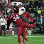 
              Arizona Cardinals safety Jalen Thompson (34) breaks up a pass intended for Tampa Bay Buccaneers wide receiver Chris Godwin during the second half of an NFL football game, Sunday, Dec. 25, 2022, in Glendale, Ariz. (AP Photo/Rick Scuteri)
            