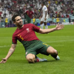 
              Portugal's Raphael Guerreiro celebrates after scoring his side's fourth goal during the World Cup round of 16 soccer match between Portugal and Switzerland, at the Lusail Stadium in Lusail, Qatar, Tuesday, Dec. 6, 2022. (AP Photo/Alessandra Tarantino)
            