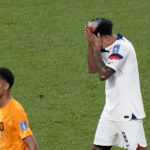 
              Weston McKennie of the United States reacts next to Cody Gakpo of the Netherlands, left, during the World Cup round of 16 soccer match between the Netherlands and the United States, at the Khalifa International Stadium in Doha, Qatar, Saturday, Dec. 3, 2022. (AP Photo/Luca Bruno)
            