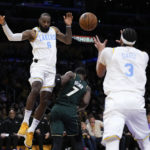 
              Los Angeles Lakers' LeBron James (6) passes the ball to Anthony Davis (3) during first half of an NBA basketball game against the Boston Celtics Tuesday, Dec. 13, 2022, in Los Angeles. (AP Photo/Jae C. Hong)
            