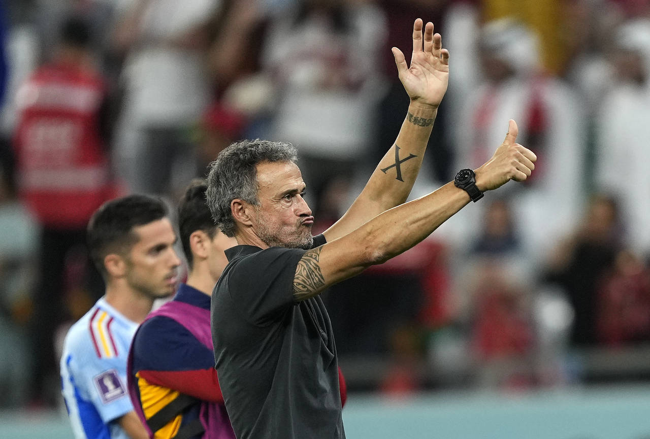 Spain's head coach Luis Enrique reacts to supporters at the end of the World Cup round of 16 soccer...