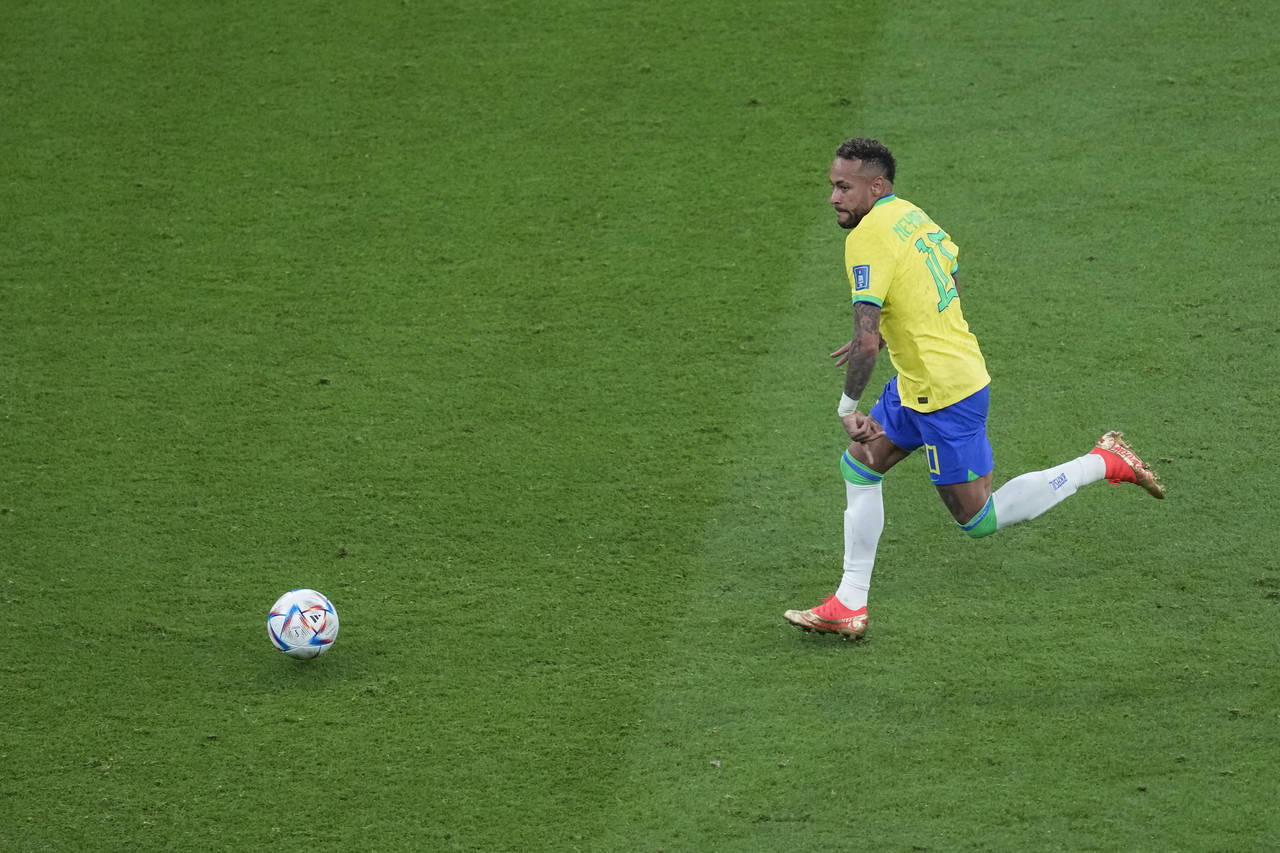 Brazil's Neymar, runs for the ball during the World Cup group G soccer match between Brazil and Ser...