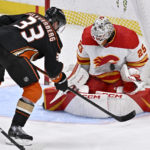 
              Calgary Flames goaltender Jacob Markstrom, right, stops a shot by Anaheim Ducks right wing Jakob Silfverberg during the third period of an NHL hockey game in Anaheim, Calif., Friday, Dec. 23, 2022. (AP Photo/Alex Gallardo)
            