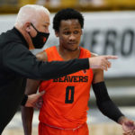 
              FILE - Oregon State head coach Wayne Tinkle, left, confers with guard Gianni Hunt in the first half of an NCAA college basketball game against Colorado on Feb. 8, 2021, in Boulder, Colo. Tinkle will be rooting for Gianni Hunt, a junior guard at Sacramento State who left Oregon State's program earlier this year. Hunt sought a fresh start after his playing time failed to develop as he had hoped. He took a leave of absence from the Beavers last season when his "love for the game had deteriorated," he said. (AP Photo/David Zalubowski, File)
            