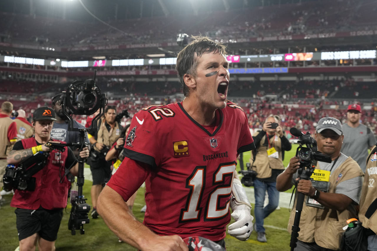 Tampa Bay Buccaneers quarterback Tom Brady (12) reacts to the fans as he runs off the field after a...