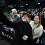 
              Actor Donnie Wahlberg poses for a selfie with fans before an NBA basketball game between the Boston Celtics and the Miami Heat, Friday, Dec. 2, 2022, in Boston. (AP Photo/Michael Dwyer)
            