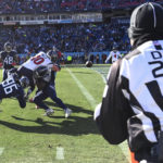 
              Houston Texans quarterback Davis Mills (10) fumbles the ball as Tennessee Titans defensive end Denico Autry (96) makes the hit during the first half of an NFL football game, Saturday, Dec. 24, 2022, in Nashville, Tenn. Down judge Mark Hittner (28) is seen watching the play. (AP Photo/Mark Zaleski)
            