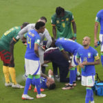
              Brazil's Alex Telles is injured during the World Cup group G soccer match between Cameroon and Brazil, at the Lusail Stadium in Lusail, Qatar, Friday, Dec. 2, 2022. (AP Photo/Alessandra Tarantino)
            