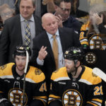 
              Boston Bruins head coach Jim Montgomery talks with his players during the first period of an NHL hockey game, Monday, Dec. 5, 2022, in Boston. The Bruins hired Montgomery at the start of the 2022 season as their new coach, giving the hockey lifer another chance at an NHL head-coaching job less than three years since he lost his first one. (AP Photo/Charles Krupa, File)
            