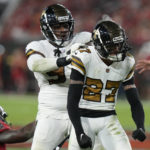 
              New Orleans Saints cornerback Alontae Taylor (27) celebrates a defensive stop with defensive end Malcolm Roach in the first half of an NFL football game against the Tampa Bay Buccaneers in Tampa, Fla., Monday, Dec. 5, 2022. (AP Photo/Chris O'Meara)
            