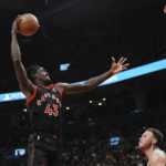 
              Toronto Raptors Pascal Siakam (43) dunks on Boston Celtics Blake Griffin during the first half of an NBA basketball game in Toronto, Monday, Dec. 5, 2022. (Chris Young/The Canadian Press via AP)
            