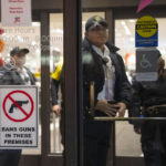 
              Officials lock down the west wing of the Mall of America after a shooting was reported, Friday, Dec. 23, 2022 in Bloomington, Minn. A shooting sent the Mall of America into lockdown Friday evening, mall officials and police in suburban Minneapolis said. (Alex Kormann/Star Tribune via AP)
            