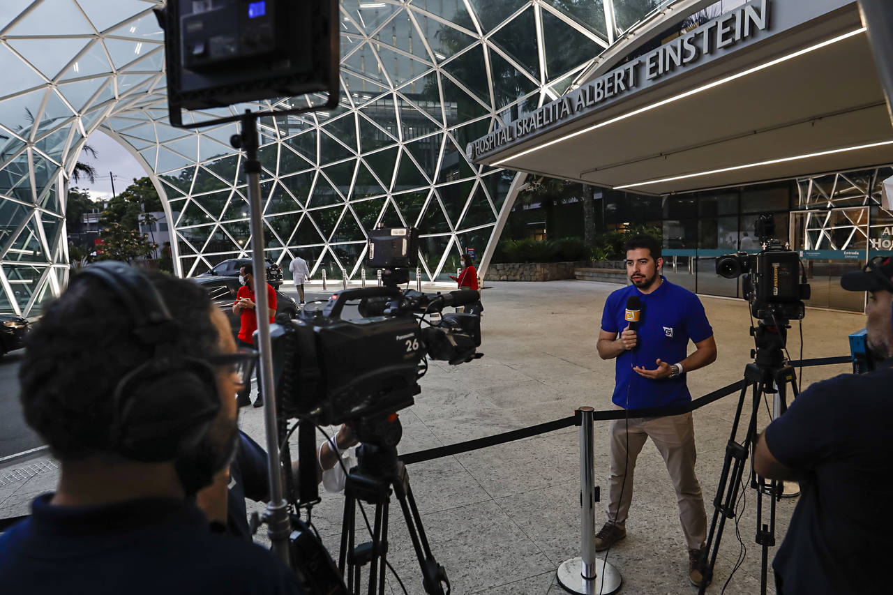 Media professionals work in front of the Albert Einstein Hospital where former soccer player Pele h...