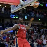 
              New Orleans Pelicans forward Zion Williamson (1) reacts after dunking against Phoenix Suns guard Devin Booker, bottom left, in the second half of an NBA basketball game in New Orleans, Friday, Dec. 9, 2022. (AP Photo/Matthew Hinton)
            