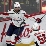 
              Washington Capitals left wing Marcus Johansson, top, celebrates after his winning overtime goal with defenseman Erik Gustafsson during overtime NHL hockey game action against the Ottawa Senators, Thursday, Dec. 22, 2022, in Ottawa. (Adrian Wyld/The Canadian Press via AP)
            