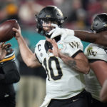 
              Wake Forest quarterback Sam Hartman (10) gets his pass knocked down by Missouri defensive lineman Jayden Jernigan during the first half of the Gasparilla Bowl NCAA college football game Friday, Dec. 23, 2022, in Tampa, Fla. (AP Photo/Chris O'Meara)
            
