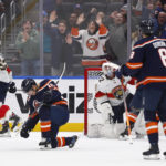 
              New York Islanders center Aatu Raty (16) celebrates after his goal in his first NHL hockey game during the third period against the Florida Panthers, Friday, Dec. 23, 2022, in Elmont, New York. (AP Photo/John Munson)
            