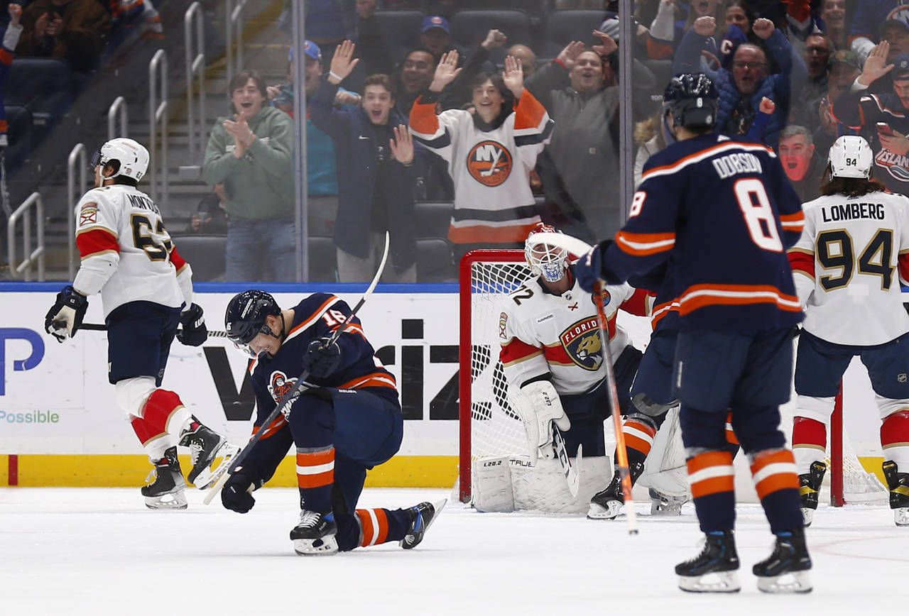 New York Islanders center Aatu Raty (16) celebrates after his goal in his first NHL hockey game dur...